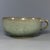This antique Chinese Longquan celadon handled cup features beautiful crackle glaze all over the body. It has a single side...