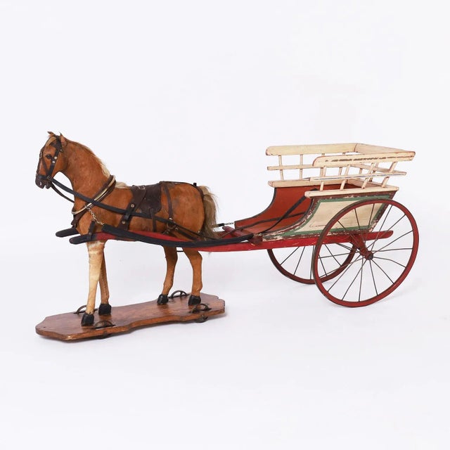 Impressive hand crafted toy horse and cart with a realistic cowhide cover horse with authentic tack on a wood platform...