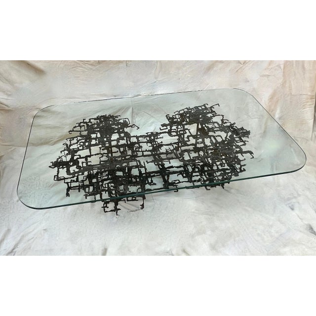 A hand crafted Patinated Bronze Brutalist Cocktail Table by Iconic Artist, Daniel Gluck. Daniel Gluck's pieces are more...