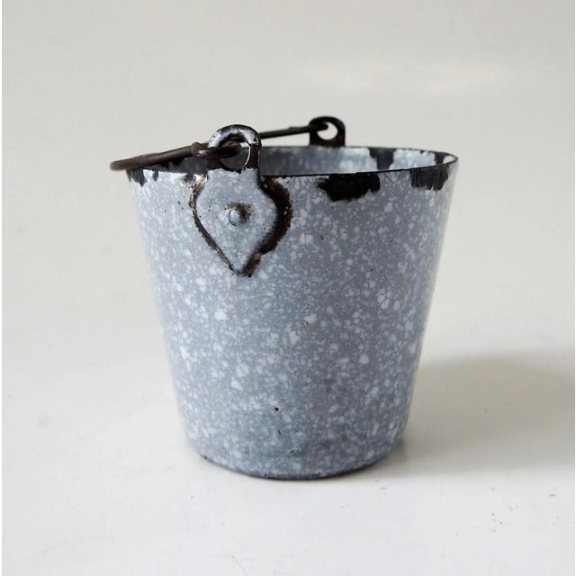 Small graniteware bucket or pail, likely came from a toy shildrens set. Great for use as a matchholder. No markings,...