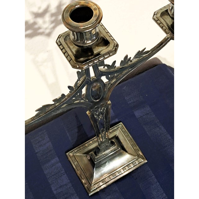 This candlestick was manufactured between 1890 and 1894. In 1890, Engelbert Kayser had taken over the arts and crafts...