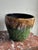 This RRP Art Deco Pottery Sun & Moon Planter is glazed with a distinctive majolica style green and brown drip glaze. It...