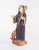 Wooden sculpture representing Saint Benedict. Black habit with staff in hand and at his feet, the skullcap on top of a...