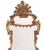 An Italian rococo giltwood mirror, richly carved, mid-19th century.