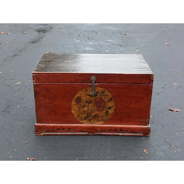 Small wood vintage Chinese trunk with red painted front and central circle with flower motif. Lightweight. 25.5" Width...