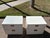 This is a striking vintage pair of campaign-style nightstands from the celebrated "Bel Air" collection by luxury maker...