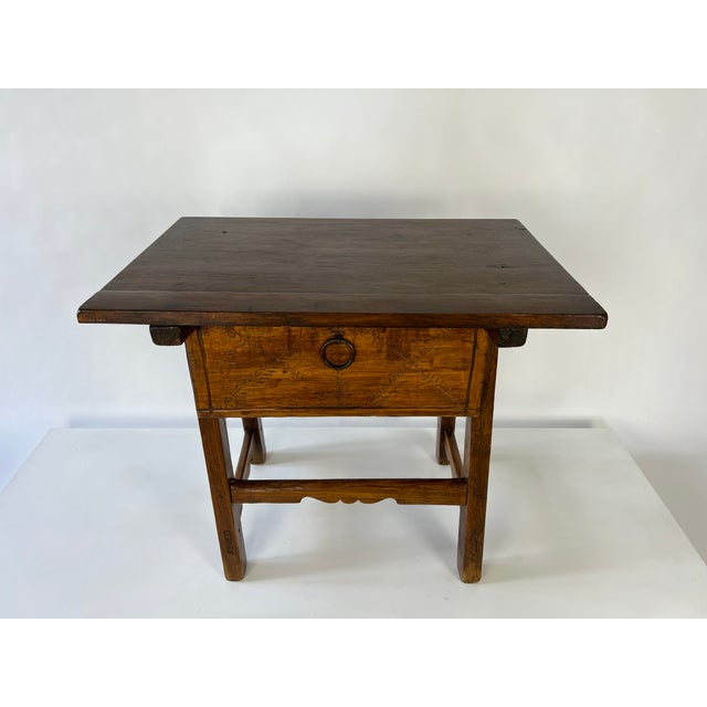 Vintage rustic side table, hand crafted in a primitive vernacular style. The table features a plank top, single drawer...