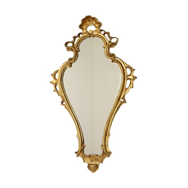 Beautiful narrow golden crested mirror, entirely in classic Baroque style, the frame is made of resin and decorated with...