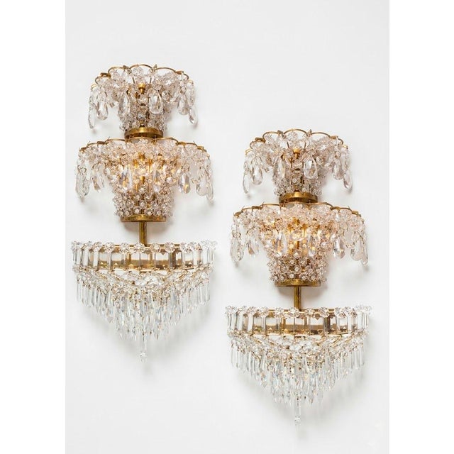 They operate with 5 small E14 screw-in light bulbs. Two in the lower and middle trays and one in the upper tray. European...