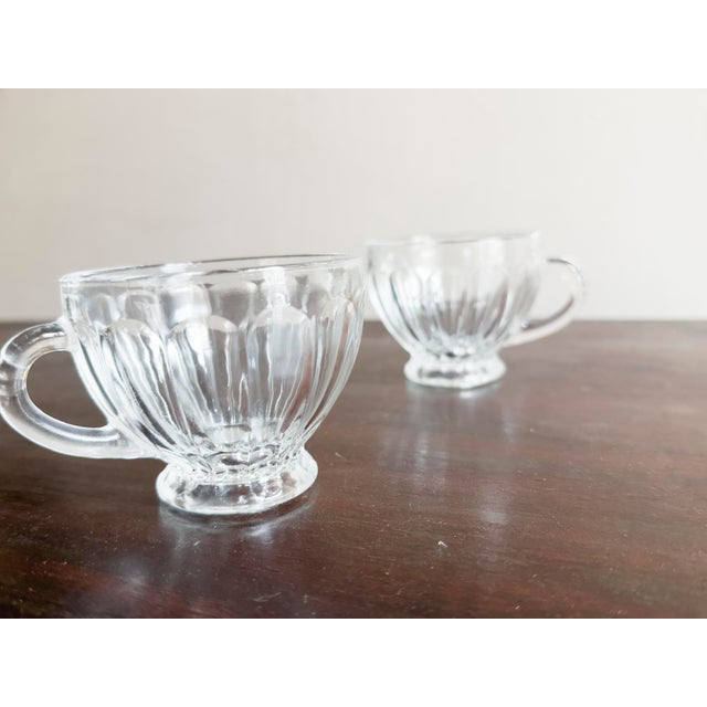 Early 20th-century American pressed crystal punch bowl in the Old Dominion style, attributed to L.E. Smith. The bowl...