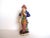 An antique Staffordshire figurine of a man dressed "a la turquoise" in a blue coat with a turban. Expected age crazing....