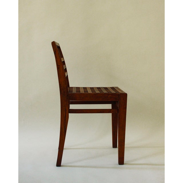 An exceptional set of three René Gabriel 103 chairs with slatted seats, crafted from solid beechwood in the 1940s. These...
