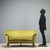 A 1950s Italian-made bean-shaped sofa, characterized by the soft, enveloping lines typical of the era's design. The frame...
