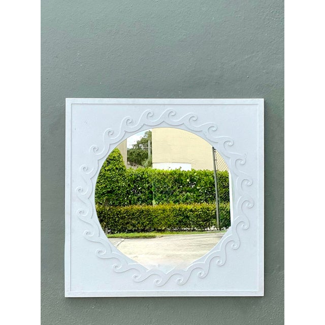 Exuding refined coastal elegance and organic mid-century design, this vintage aluminum wall mirror makes a striking...