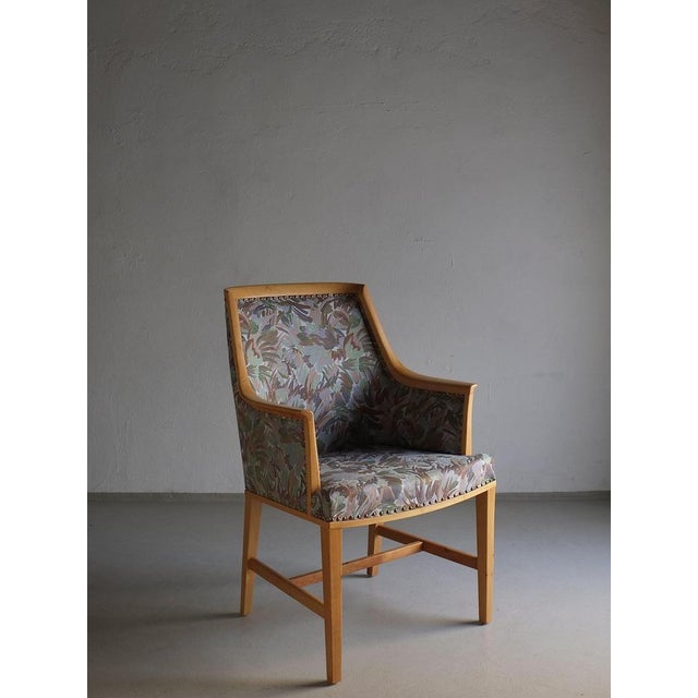 Swedish grace period armchair with a birch wood frame. It has beautiful curved lines, and the design reminds me of chairs...