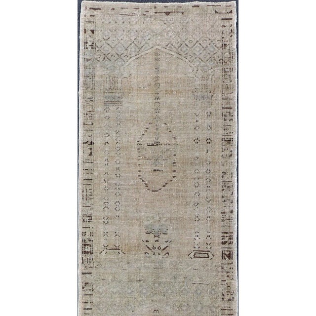 Distressed Turkish long and narrow runner with floral design and neutral colors. rug/, 1940 vintage Oushak runner...