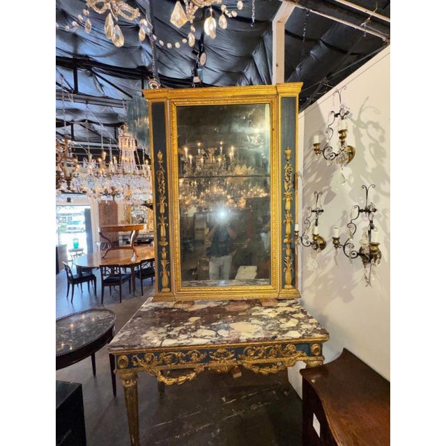 The 18th c. Italian Neoclassical Parcel Gilt Mirror is a stunning piece of home décor that exudes elegance and...