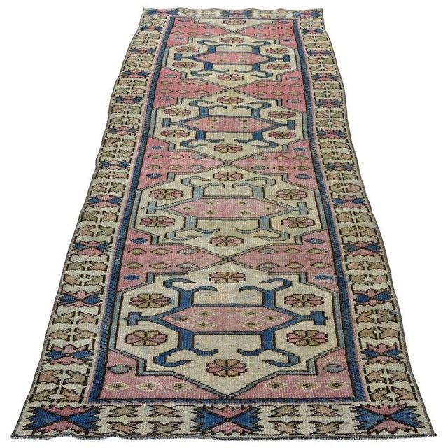 Hand-knotted with care using traditional rug-making techniques, this wool rug blends timeless craftsmanship with a modern...