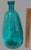 Crafted with a keen eye for style and a consciousness for recycling, this Vintage Large 14.75'' High Aqua Blue Glass...