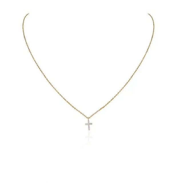This is part of Chairish’s Fine Jewelry assortment. Dainty Diamond Studded Cross Pendant Necklace with Chain in 18K Gold...
