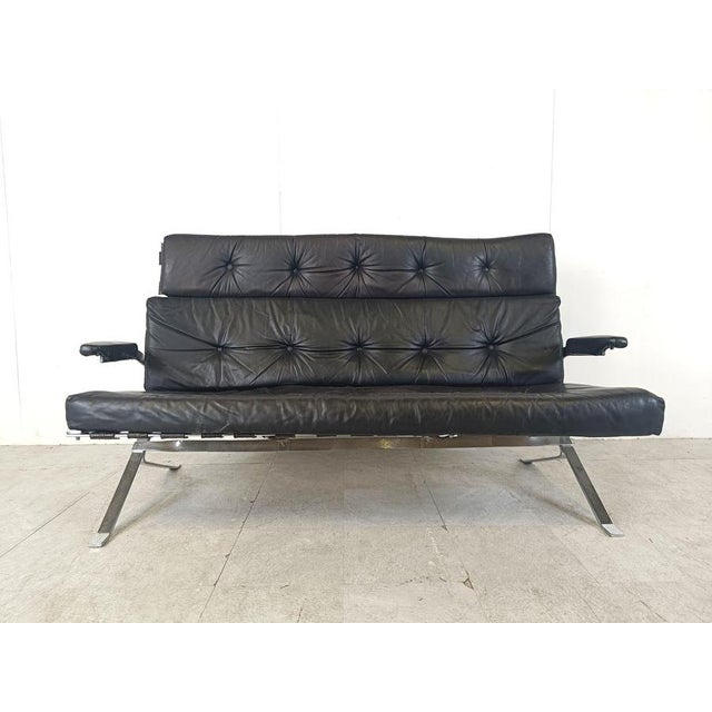 Vintage two seater sofa made from a chromed steel frame and black leather seats and armrests. Very much in the style of...