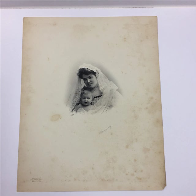 Beautiful mother and baby in lace mantilla or veil. Oval embossment harmonizes with the original image. Printed at...