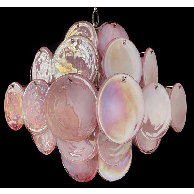 Vintage Italian Murano chandelier in Vistosi style. The chandelier has 36 fantastic iridescent alabaster pink discs in a...