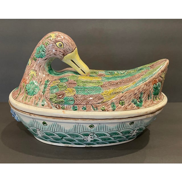Antique heavy porcelain Famille Verte soup tureen, the lid in the form of a sleeping duck, the base oval with water...