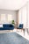 Versatile Agra Blue Hand Knotted Wool Rug, Country of Origin: India. This exceptional piece is defined by its deeply...
