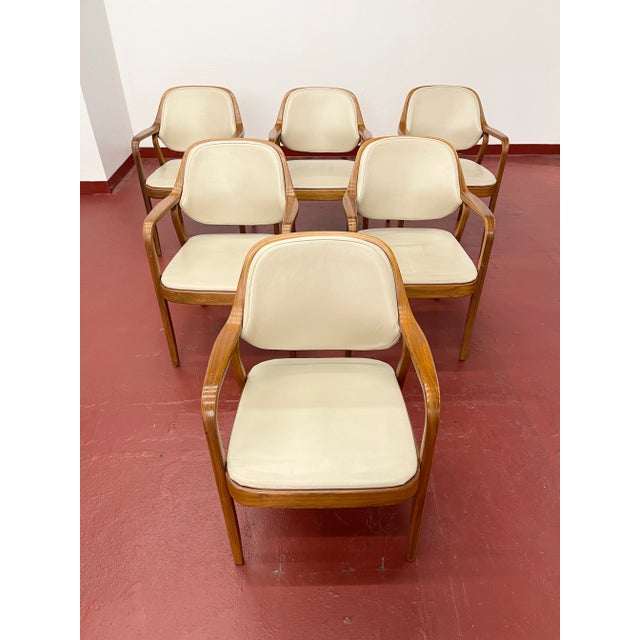 Six bentwood armchairs Model #1105 by Don Petitt for Knoll. Two lengths of pressed and bent layers of sculpted wood make...