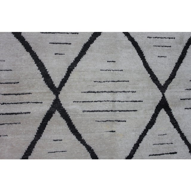 A beautiful handmade environmentally friendly Bamboo and silk rug, with a geometric design is made of 75% bamboo silk and...