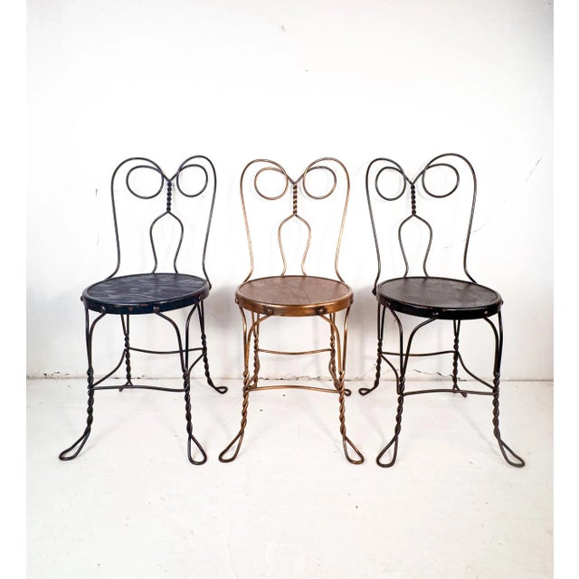A trio of vintage ice cream parlor chairs that have been given a makeover sometime in the past, and are solid and ready to...