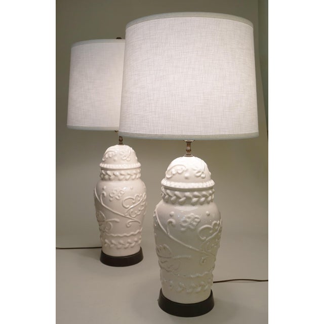 A striking and sophisticated perfectly matched pair of Majolica styled monumental Ginger Jar shaped porcelain lamps with...