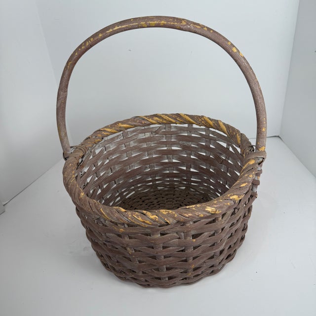 This item is a vintage, we've had it 1970's-1980's it is a hand-woven basket featuring a bamboo or oak splint construction...