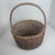 This item is a vintage, we've had it 1970's-1980's it is a hand-woven basket featuring a bamboo or oak splint construction...