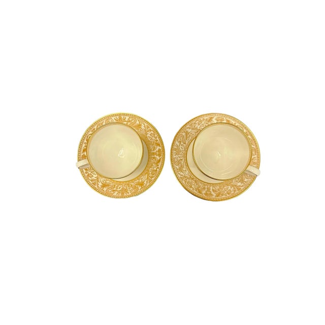Elegant set of Leigh shaped footed Wedgwood Gold Florentine cups and saucers. This bone china set features a scrolling...
