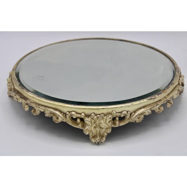 A stunning vintage French mirrored plateau tray, circa 1960s. This is a lovely footed tray with an ornate design.