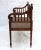 Stunning hand-carved bench or settee done in Louis XVI style. It features a strong faux cane resin seat and rich ornaments...