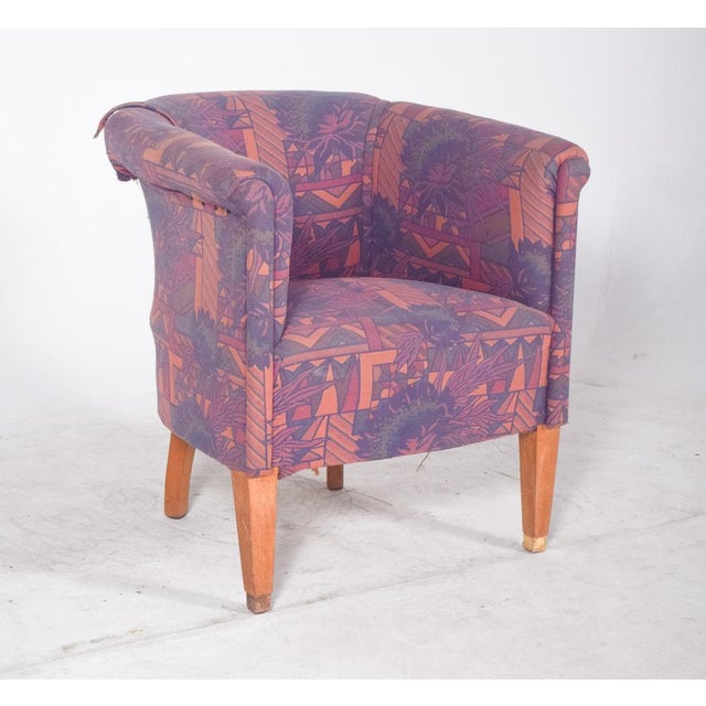 Low ‘little lady’ chair. with its enveloping backrest and rounded arms, it creates a compact and cosy silhouette, ideal...