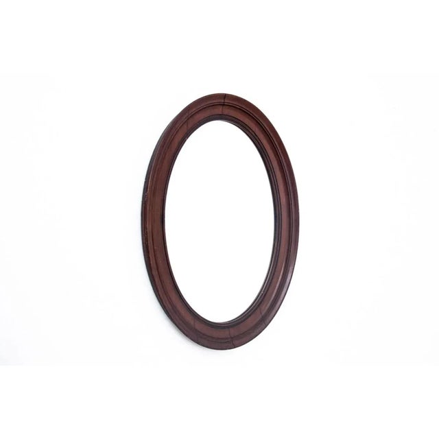 Late 19th Century Oval Mirror in a Mahogany Frame, Northern Europe, in Very Good conditions. Designed before 1890