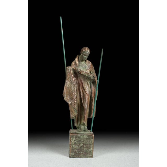 A striking classical sculpture crafted from molded resin and finished in a rich bronze tone with Verde green accents for...