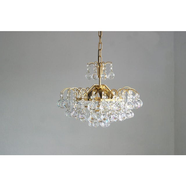 The brass and crystal glass christoph palme chandelier is well known for its hand-cut crystals and original design. in...