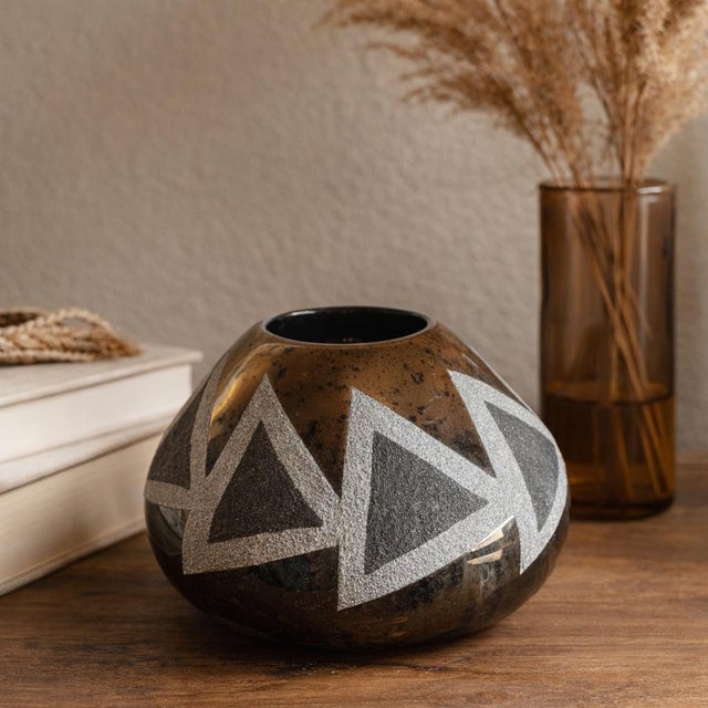 A striking Native American studio pottery vessel by New Mexico artist Craig White Eagle, featuring a rich bronze reduction...