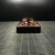 Crafted from dark, richly grained rosewood (likely blood sandalwood or similar hardwood), these rectangular paperweights...