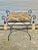 Wonderful vintage vanity bench. Made of iron with a floral upholstered seat. Fabric tassels on each corner. Regal and...