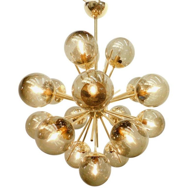 Italian sputnik chandelier with 18 smoky Murano glass globes carefully hand blown with bubbles inside the glass using...