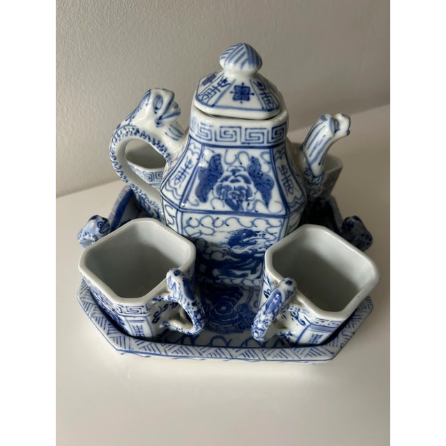 Lovely, charming little blue & white dragon tea set. Each piece features fanciful dragon handles, and the teapot also has...