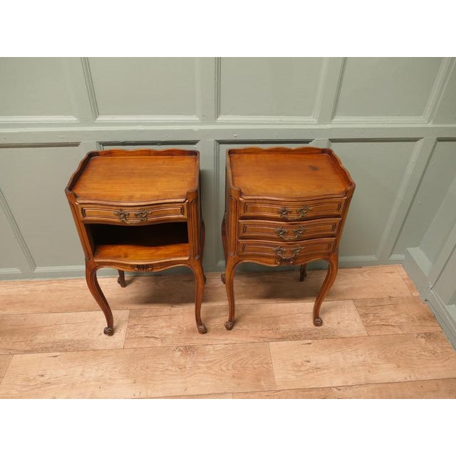 This is a pretty pair of cabinets or chevets, they have a slightly bow front shape and a scalloped gallery around the top,...