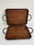 Set of two handmade rectangular serving trays with solid wood bases and hand-forged metal frames and handles. The trays...