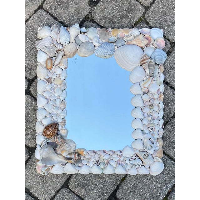 We love how this mirror has been encrusted with perfectly imperfect ‘found’ shells. The rustic style and organic placement...